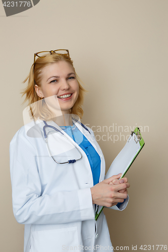 Image of Young woman with green folder