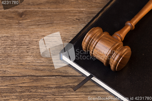 Image of Judge hammer lies on book