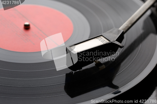 Image of Black vinyl plate with player