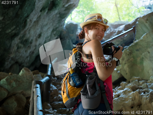 Image of Girl with camera in cave