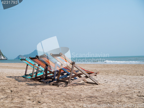 Image of Sandy beach with deck chairs