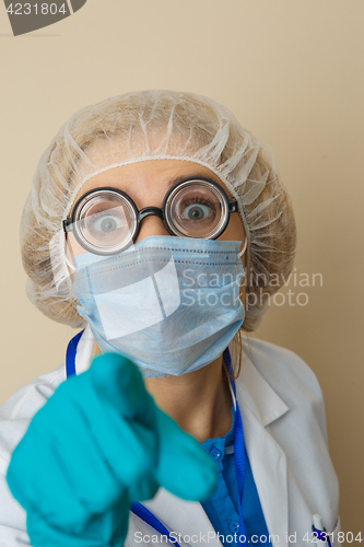 Image of Young doctor in mask, glasses