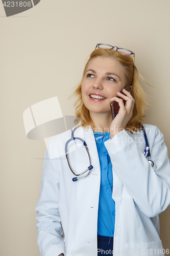 Image of Blonde in robe with phone