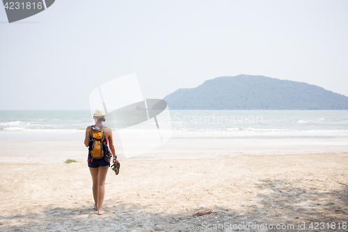 Image of Young girl on sandy beach