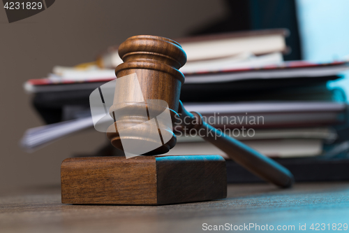 Image of Hammer, paper lies on table