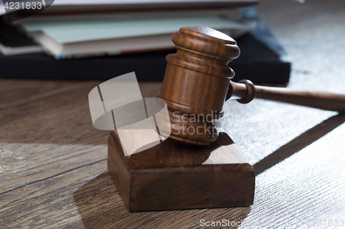 Image of Judge hammer against of folder