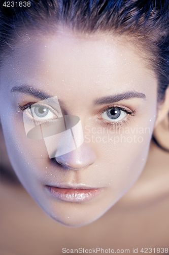 Image of Beautiful woman face portrait close up on blue