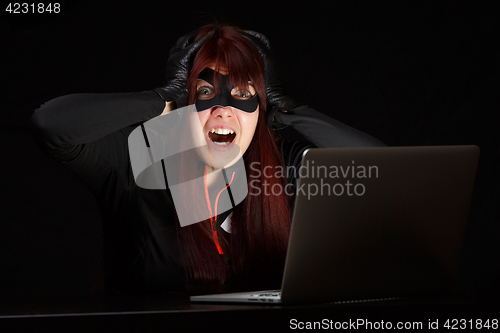 Image of Woman steals information from computer