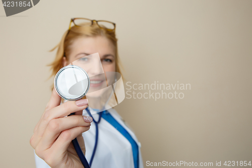 Image of Beautiful doctor in medical dressing