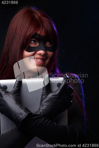 Image of Happy thief in black gloves