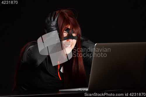 Image of Happy hacker in black mask