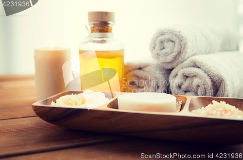 Image of close up of soap, himalayan salt and scrub in bowl