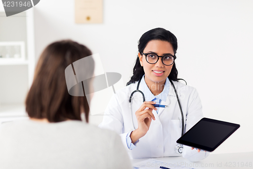 Image of doctor with tablet pc and woman at hospital