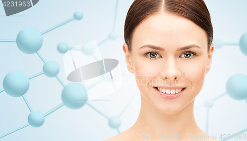 Image of beautiful young woman face with molecules