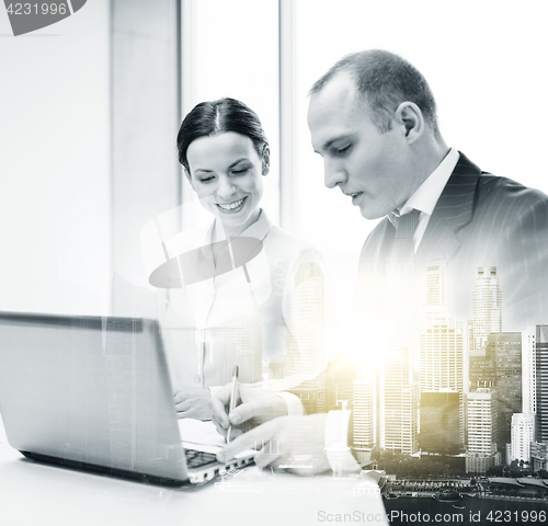 Image of business team with laptop working at office