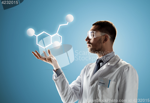 Image of scientist in safety glasses with molecular formula