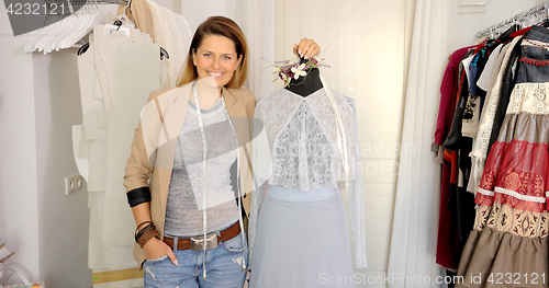Image of Tailor posing with mannequin