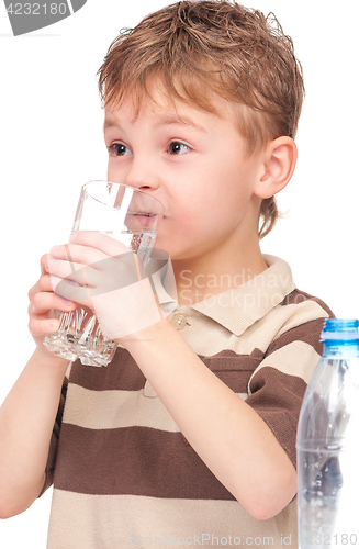 Image of Boy with glass and plastic bottle of water