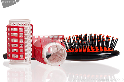 Image of Hair curlers and hairbrush