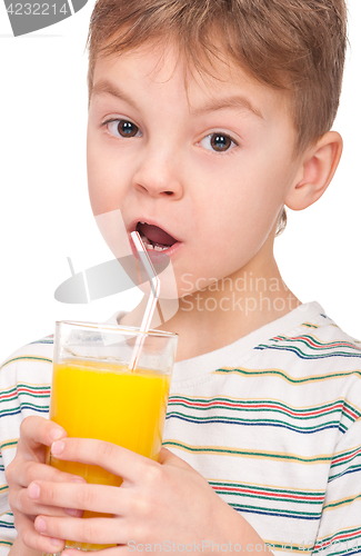 Image of Boy drinking refreshing orange juice