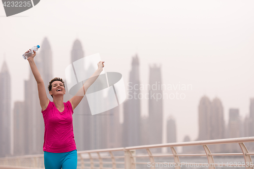 Image of young woman celebrating a successful training run