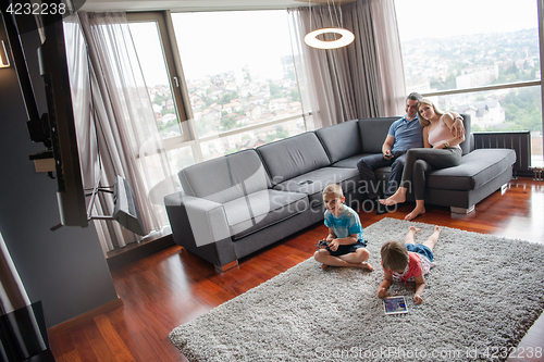 Image of couple spending time with kids