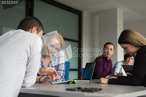 Image of Business Team At A Meeting at modern office building
