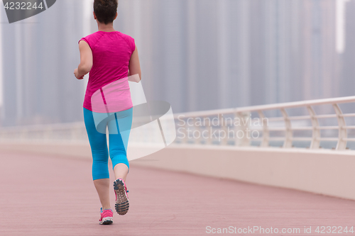 Image of woman running on the promenade