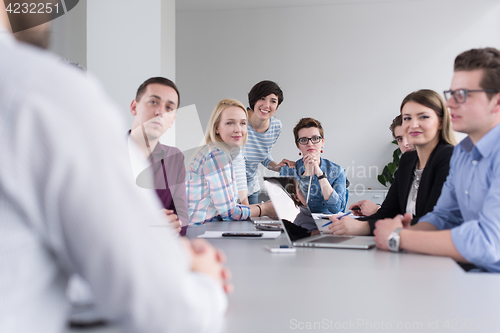 Image of Business Team At A Meeting at modern office building