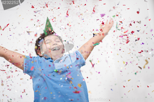 Image of kid blowing confetti