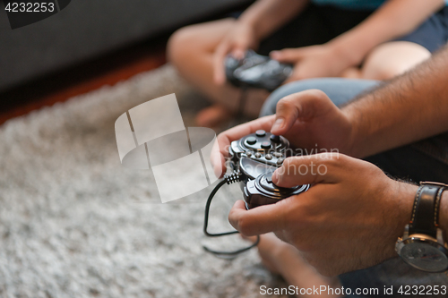 Image of Happy family playing a video game