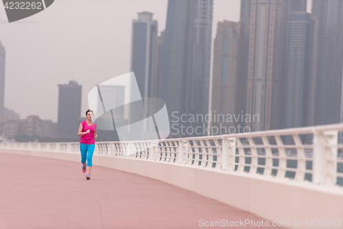 Image of woman running on the promenade