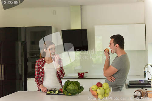 Image of Young handsome couple in the kitchen