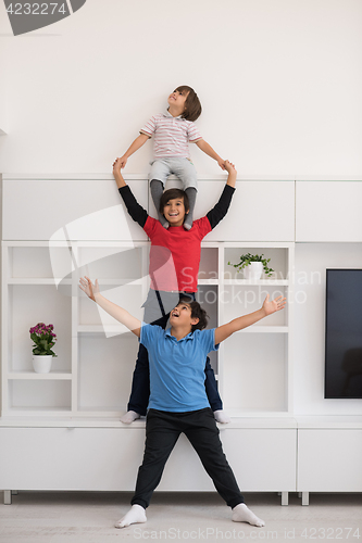 Image of young boys posing line up piggyback