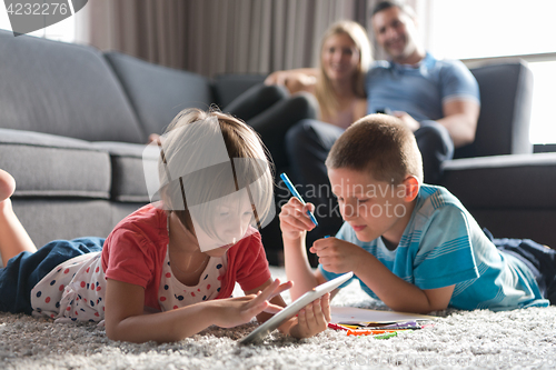 Image of young couple spending time with kids