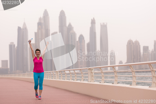 Image of young woman celebrating a successful training run