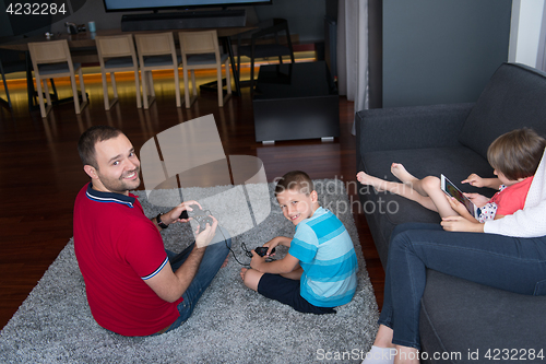 Image of Happy family playing a video game