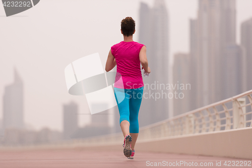 Image of woman running on the promenade