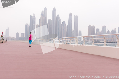 Image of woman running on the promenade