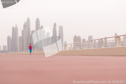 Image of woman running on the promenade