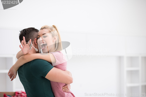 Image of happy Young couple moving in new house