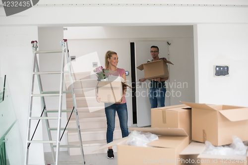 Image of young couple moving into a new home