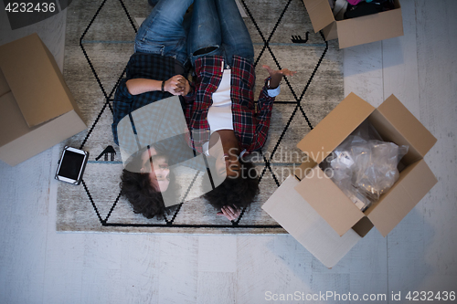 Image of Top view of attractive young multiethnic couple