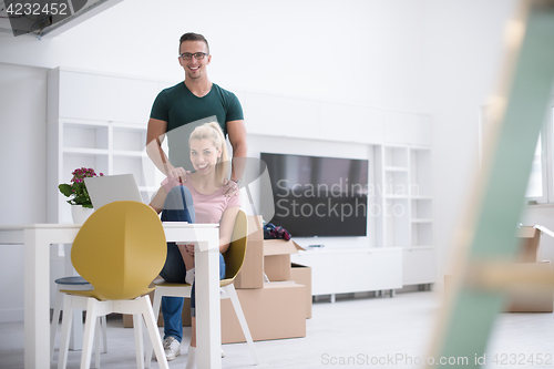 Image of Young couple moving in a new home