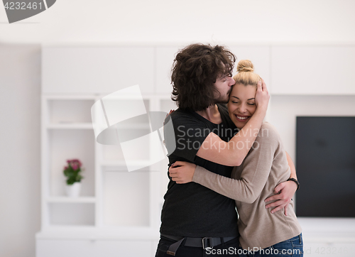 Image of couple hugging in their new home