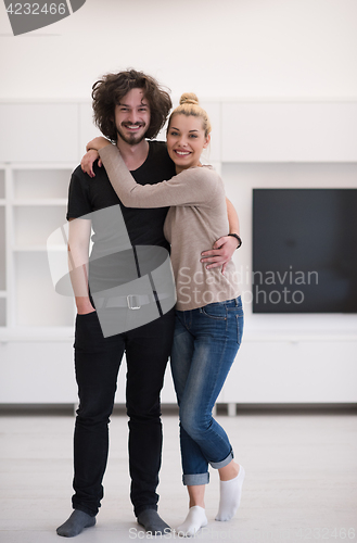 Image of couple hugging in their new home