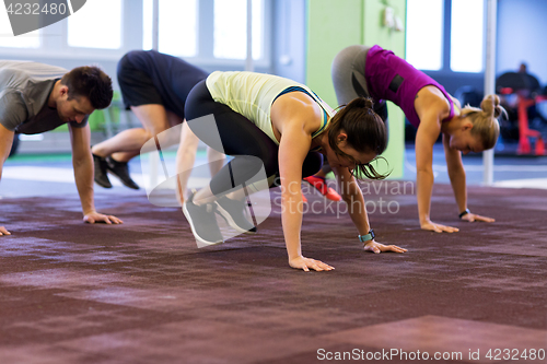 Image of group of people exercising in gym