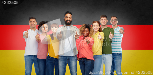 Image of international group of people showing thumbs up