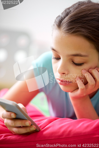 Image of close up of bored girl with smartphone at home