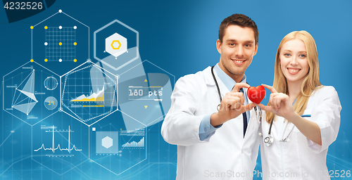 Image of doctors with red heart and charts over blue